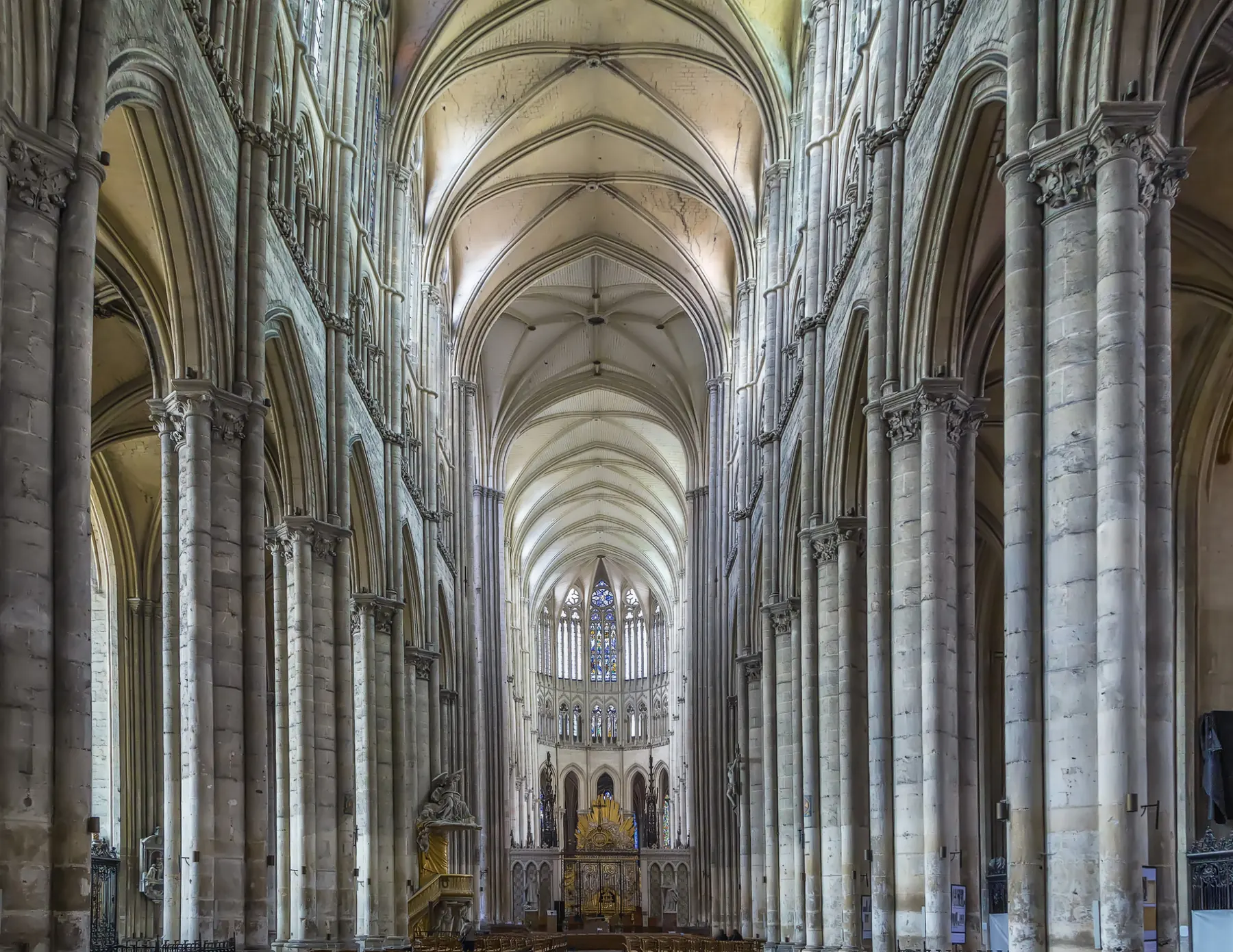 Interior of a stone cathedral nave with tall columns