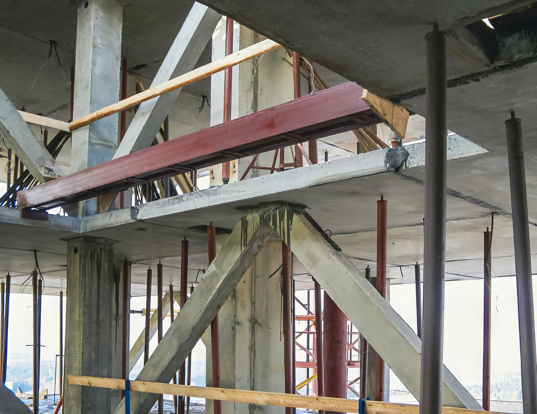 Steel beams and columns inside a building under construction, a job site where scanning vendors work